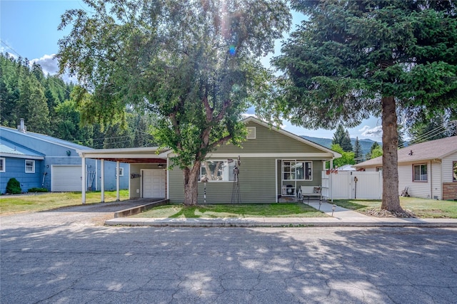 1508 Lolo Ave, Libby, MT 59923 - view of front facade with a carport, driveway, and a gate