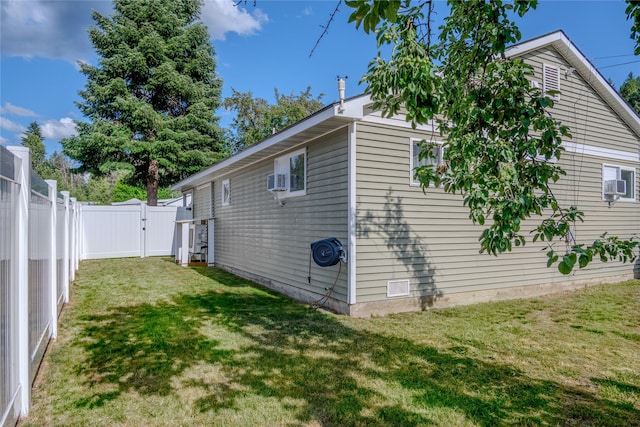 1508 Lolo Ave, Libby, MT 59923 - view of side of home featuring a gate, a fenced backyard, and cooling unit