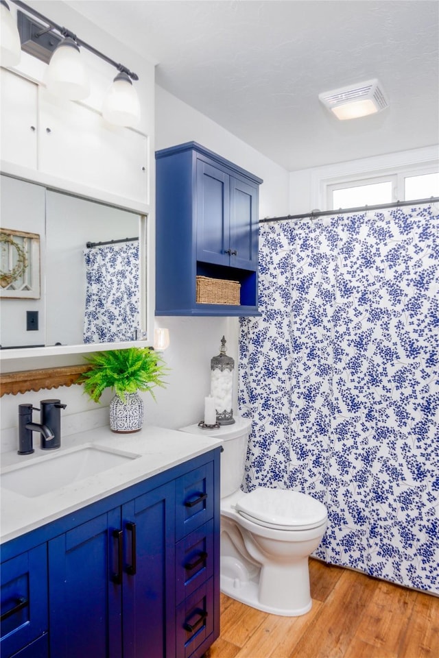1508 Lolo Ave, Libby, MT 59923 - bathroom with vanity, wood finished floors, and curtained shower