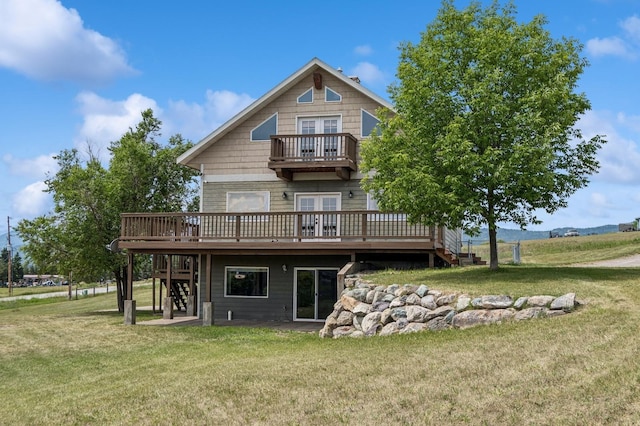 75 N Hill Rd, Kalispell, MT 59901 - rear view of property with a balcony, stairway, a wooden deck, and a yard