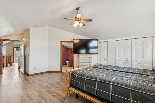 75 N Hill Rd, Kalispell, MT 59901 - bedroom with vaulted ceiling, two closets, light wood-style floors, ensuite bathroom, and a ceiling fan
