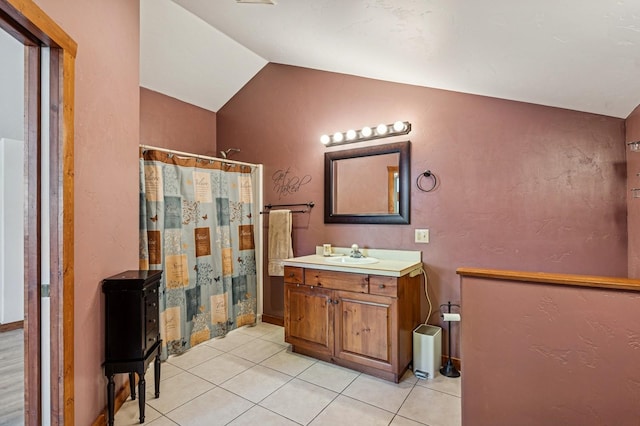 75 N Hill Rd, Kalispell, MT 59901 - full bathroom featuring vaulted ceiling, vanity, tile patterned floors, and curtained shower