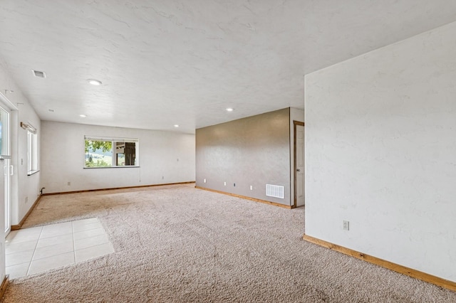 75 N Hill Rd, Kalispell, MT 59901 - carpeted spare room featuring baseboards and recessed lighting