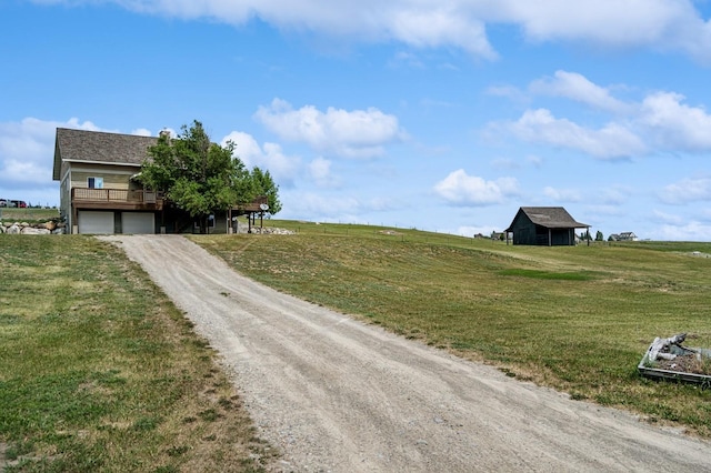 75 N Hill Rd, Kalispell, MT 59901 - view of dirt / gravel road featuring a view of countryside