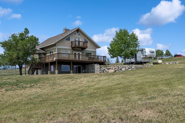 75 N Hill Rd, Kalispell, MT 59901 - rear view of property with a deck, stairway, a balcony, a lawn, and a chimney