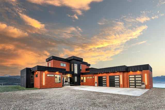 4722 Skalkaho Rd, Philipsburg, MT 59858 - contemporary home featuring an attached garage and concrete driveway