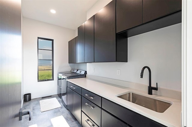 4722 Skalkaho Rd, Philipsburg, MT 59858 - kitchen with independent washer and dryer, light countertops, dark cabinets, and recessed lighting