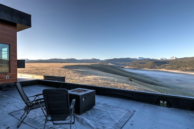 4722 Skalkaho Rd, Philipsburg, MT 59858 - view of patio / terrace with a mountain view and an outdoor fire pit