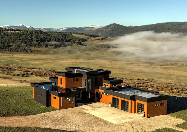4722 Skalkaho Rd, Philipsburg, MT 59858 - view of front of house featuring a mountain view, a garage, and driveway