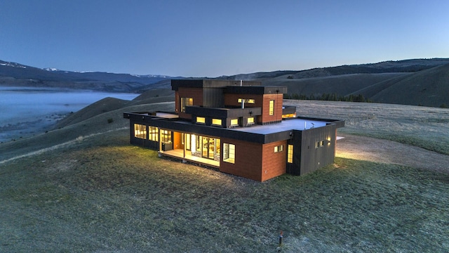 4722 Skalkaho Rd, Philipsburg, MT 59858 - rear view of house featuring a mountain view and covered porch