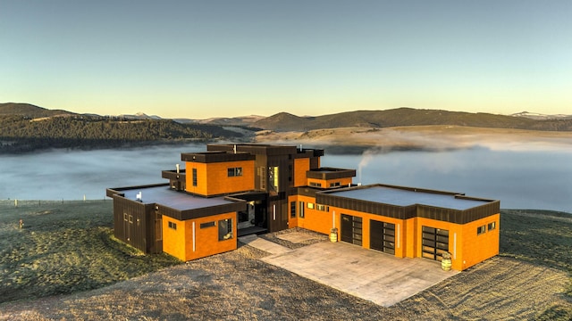 4722 Skalkaho Rd, Philipsburg, MT 59858 - modern home featuring a water and mountain view and a garage