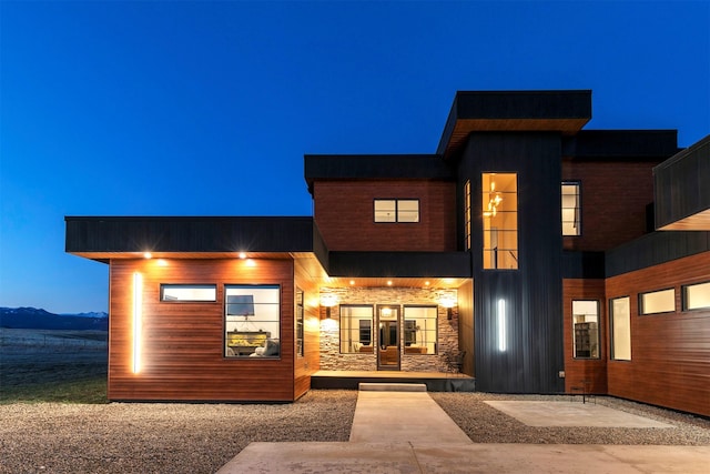 4722 Skalkaho Rd, Philipsburg, MT 59858 - view of front of house featuring covered porch, stone siding, and a mountain view