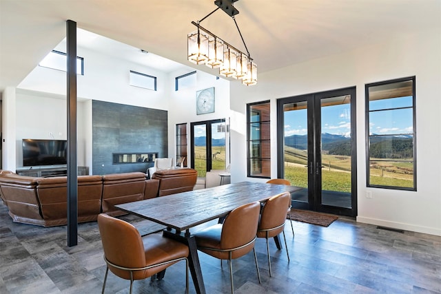 4722 Skalkaho Rd, Philipsburg, MT 59858 - dining room featuring french doors, a towering ceiling, and dark wood-type flooring