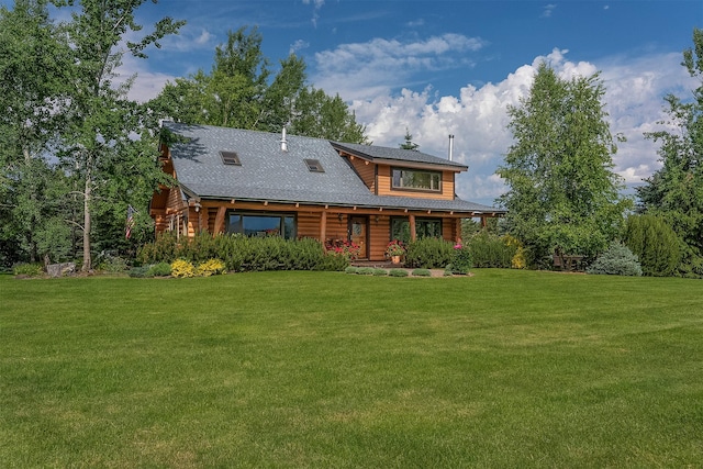182 Moondance Trl, Bigfork, MT 59911 - rear view of house with a lawn, roof with shingles, log exterior, and covered porch