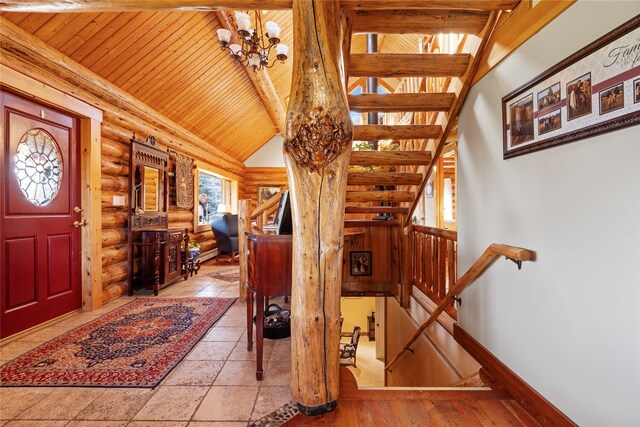 182 Moondance Trl, Bigfork, MT 59911 - foyer entrance featuring rustic walls, wood ceiling, stairway, and a chandelier