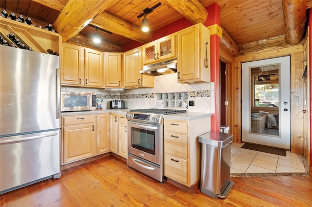 182 Moondance Trl, Bigfork, MT 59911 - kitchen with stainless steel appliances, under cabinet range hood, light brown cabinets, a wood ceiling with exposed beams, and light wood finished floors