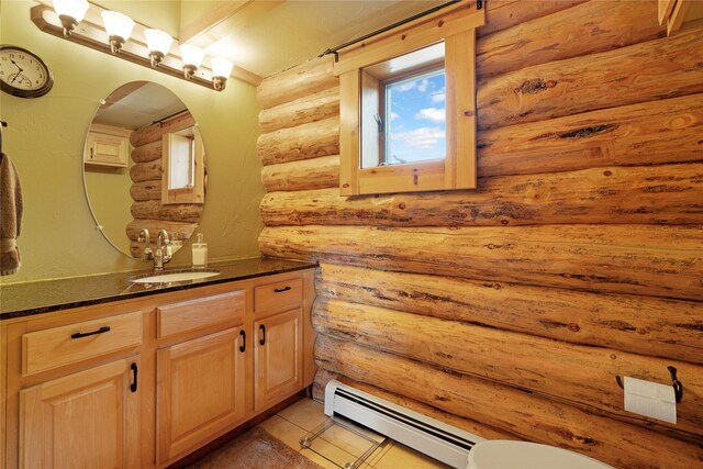 182 Moondance Trl, Bigfork, MT 59911 - half bathroom featuring a baseboard radiator, rustic walls, and vanity