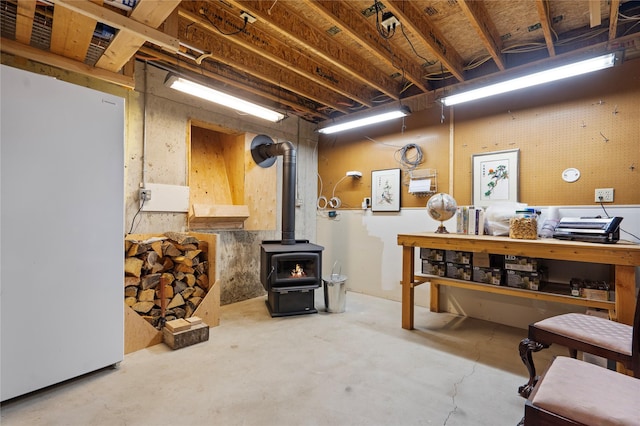 182 Moondance Trl, Bigfork, MT 59911 - unfinished basement featuring a wood stove