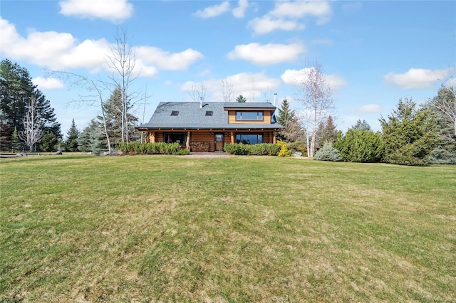182 Moondance Trl, Bigfork, MT 59911 - rear view of house featuring a yard