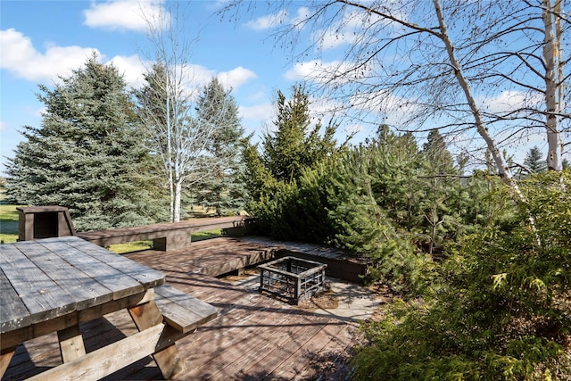 182 Moondance Trl, Bigfork, MT 59911 - view of patio with outdoor dining space, a fire pit, and a deck