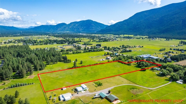 3101 Mt Highway 206, Columbia Falls, MT 59912 - aerial view of sparsely populated area featuring property boundaries highlighted and a mountain backdrop