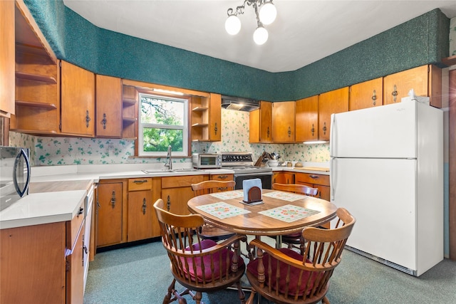 3101 Mt Highway 206, Columbia Falls, MT 59912 - kitchen featuring freestanding refrigerator, open shelves, electric range oven, light countertops, and brown cabinetry