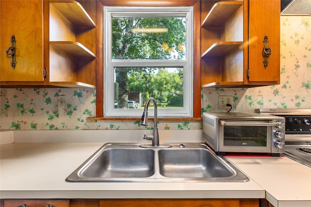 3101 Mt Highway 206, Columbia Falls, MT 59912 - kitchen featuring open shelves, wallpapered walls, light countertops, and brown cabinetry