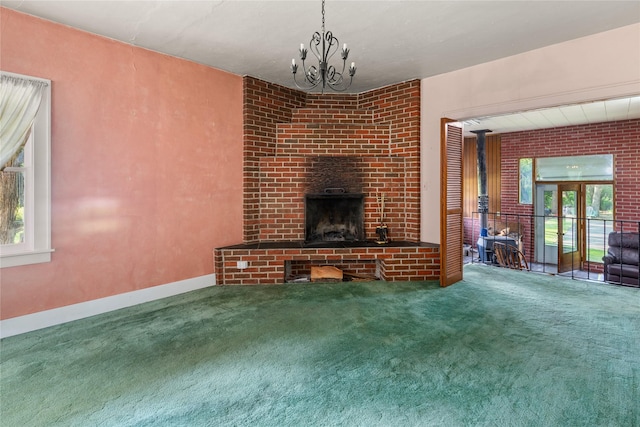 3101 Mt Highway 206, Columbia Falls, MT 59912 - unfurnished living room with carpet, plenty of natural light, and a chandelier