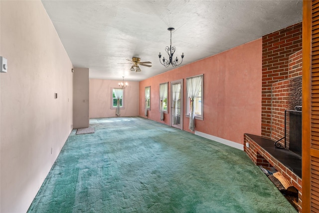 3101 Mt Highway 206, Columbia Falls, MT 59912 - unfurnished living room with a chandelier and carpet flooring