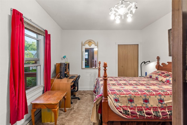 3101 Mt Highway 206, Columbia Falls, MT 59912 - bedroom with carpet floors, a chandelier, and a baseboard heating unit