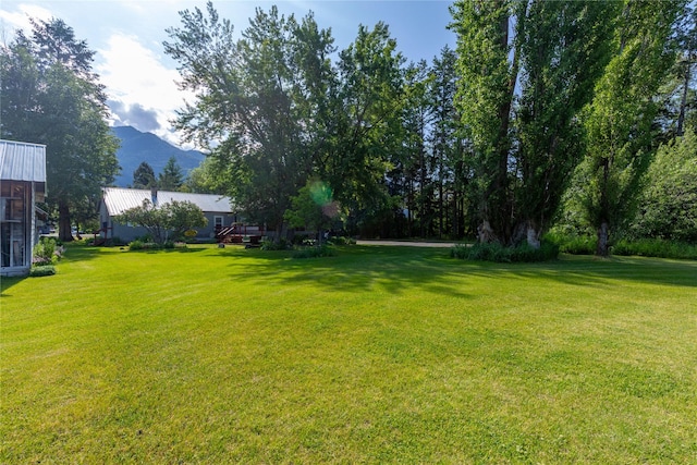 3101 Mt Highway 206, Columbia Falls, MT 59912 - view of grassy yard with a mountain view