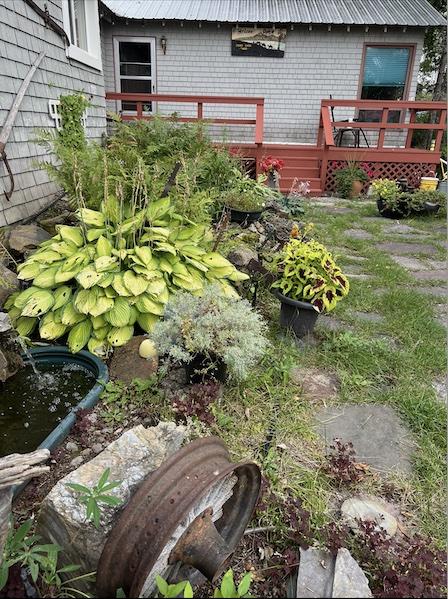 3101 Mt Highway 206, Columbia Falls, MT 59912 - view of yard featuring a wooden deck and a garden pond