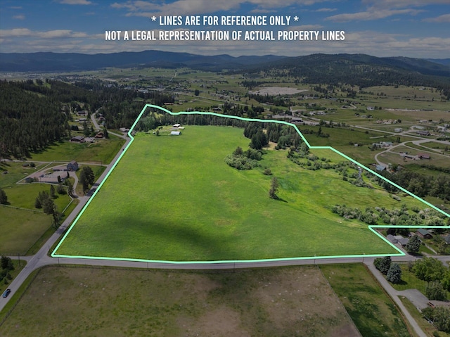 1695 Whalebone Dr, Kalispell, MT 59901 - aerial overview of property's location featuring property boundaries highlighted and a mountain backdrop