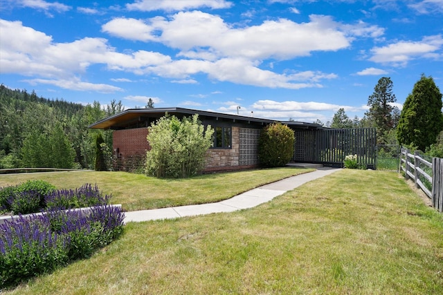1695 Whalebone Dr, Kalispell, MT 59901 - view of home's exterior with a view of trees and stone siding