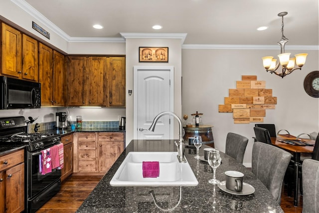 6203 Monterra Ave Unit H, Whitefish, MT 59937 - kitchen with black appliances, ornamental molding, a chandelier, dark wood-style flooring, and brown cabinets