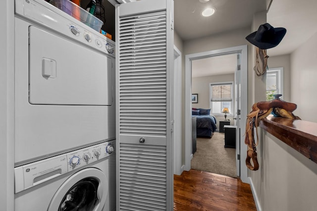 6203 Monterra Ave Unit H, Whitefish, MT 59937 - washroom with stacked washer / drying machine and dark wood finished floors
