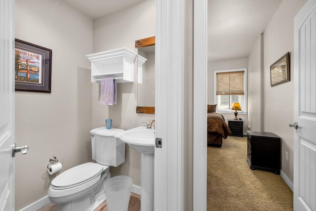 6203 Monterra Ave Unit H, Whitefish, MT 59937 - bathroom featuring toilet and baseboards