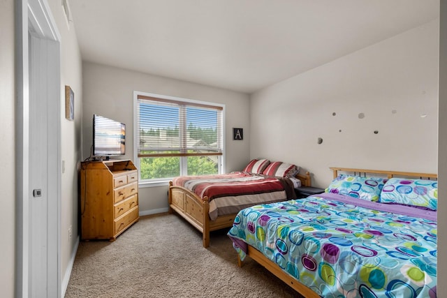 6203 Monterra Ave Unit H, Whitefish, MT 59937 - bedroom featuring light colored carpet and baseboards