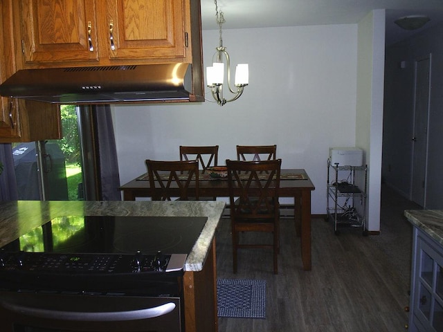 2424 Teakwood Ln, Helena, MT 59601 - dining room with dark wood finished floors and a chandelier