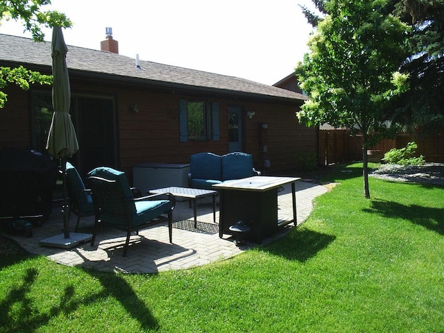 2424 Teakwood Ln, Helena, MT 59601 - back of house with a patio area, an outdoor hangout area, and a chimney