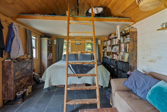 NHN Doe Run Trail, Polson, MT 59860 - bedroom with multiple windows, wooden walls, and wood ceiling