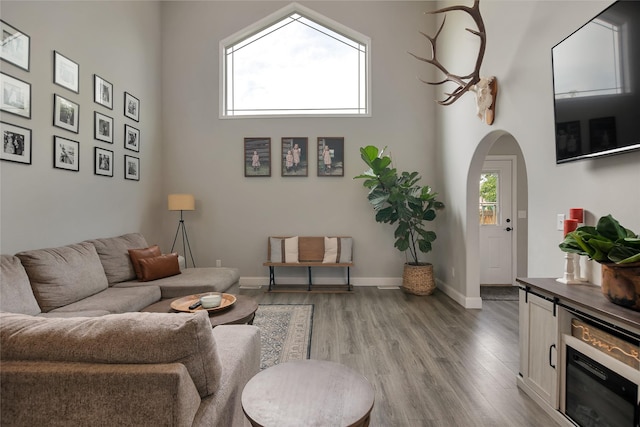 3806 Timothy Ln, Helena, MT 59602 - living room with light wood-style floors, arched walkways, and a towering ceiling