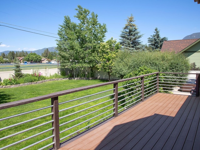 521 Evening Star Ln, Columbia Falls, MT 59912 - wooden deck featuring a mountain view