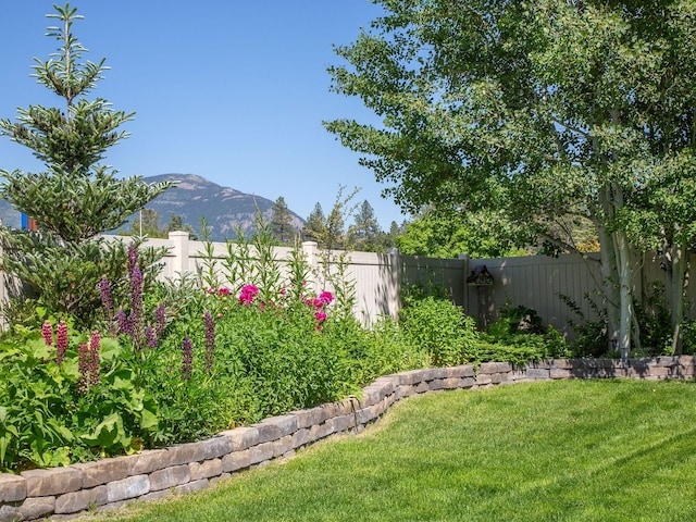 521 Evening Star Ln, Columbia Falls, MT 59912 - fenced backyard featuring a mountain view
