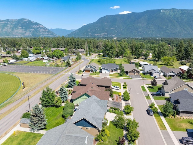 521 Evening Star Ln, Columbia Falls, MT 59912 - aerial perspective of suburban area with a mountain backdrop
