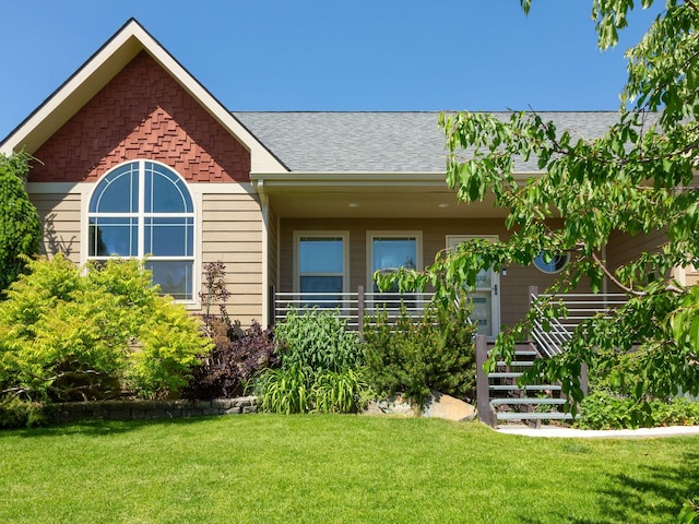 521 Evening Star Ln, Columbia Falls, MT 59912 - view of front of property with a front lawn and a shingled roof