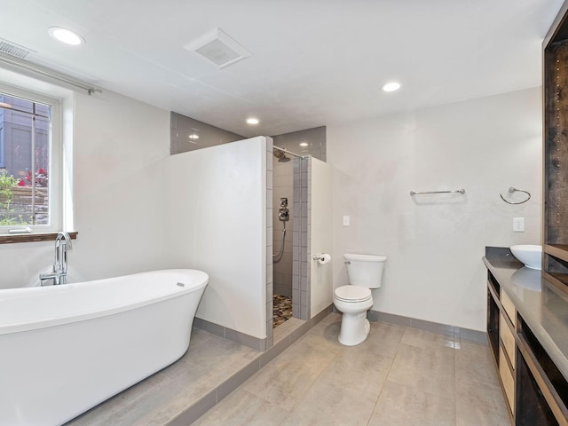 521 Evening Star Ln, Columbia Falls, MT 59912 - bathroom featuring a soaking tub, a tile shower, vanity, and recessed lighting