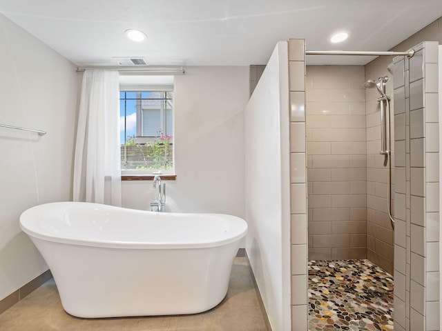 521 Evening Star Ln, Columbia Falls, MT 59912 - full bath with a freestanding tub, a tile shower, and recessed lighting