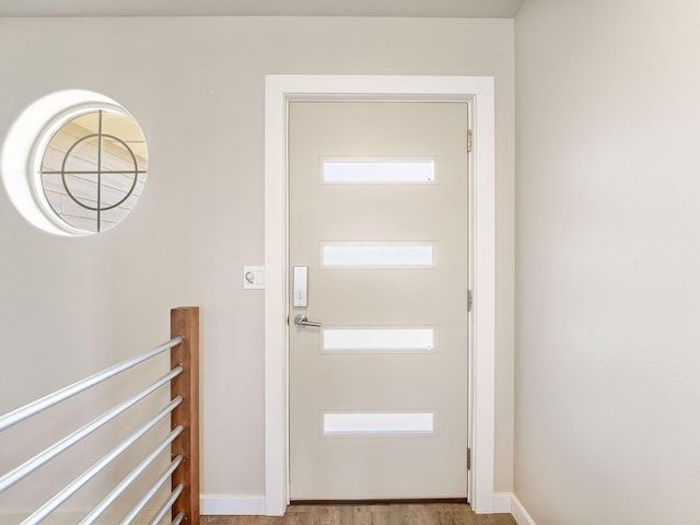 521 Evening Star Ln, Columbia Falls, MT 59912 - doorway to outside with wood finished floors and baseboards