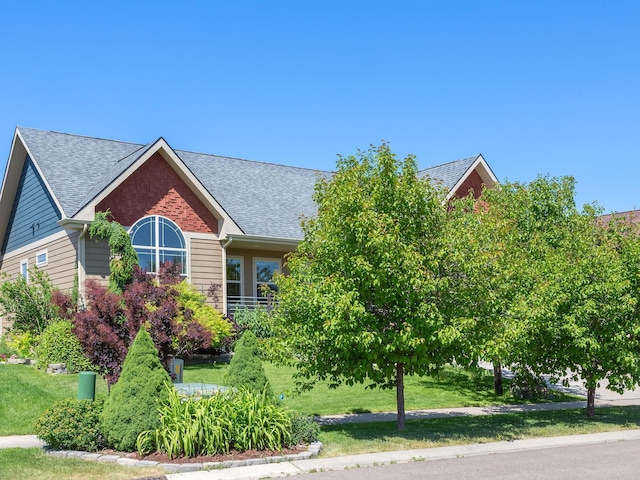 521 Evening Star Ln, Columbia Falls, MT 59912 - view of front of house featuring roof with shingles and a front yard
